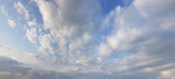 Fototapeta Niebo - Floating white cloud on blue sky background. Panoramic sky nature horizon weather skyline