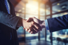 Closeup Of Two Business People Shaking Hands In Office. Handshake Concept