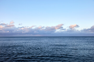 Wall Mural - Beautiful view on the sea with clouds on the horizon, selective focus