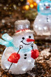 Festive decoration for Christmas. Glowing Christmas snowmen led figures. 