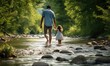 A man and a little girl walking through a river