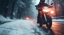 Motorcyclist Rides On A Motorbike On The Snowy Road In Winter