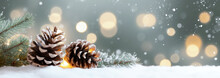 Christmas Background With Pine Cones And Snow Sparkling Lights.