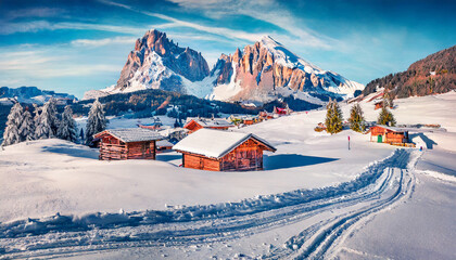 winter landscape. Frosty winter view of Alpe di Siusi village with Plattkofel peak on background. Amazing morning scene of Dolomite Alps, Ityaly, Europe. Traveling concept background