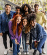 © Aida - Multiracial young group of happy people taking selfie portraits - Diverse millennial friends laughing and having fun together, city travelers, students.
