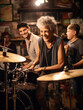 © Nathan Hutchcraft - A Photo of a Senior Woman Playing the Drums in a Band with Young Musicians