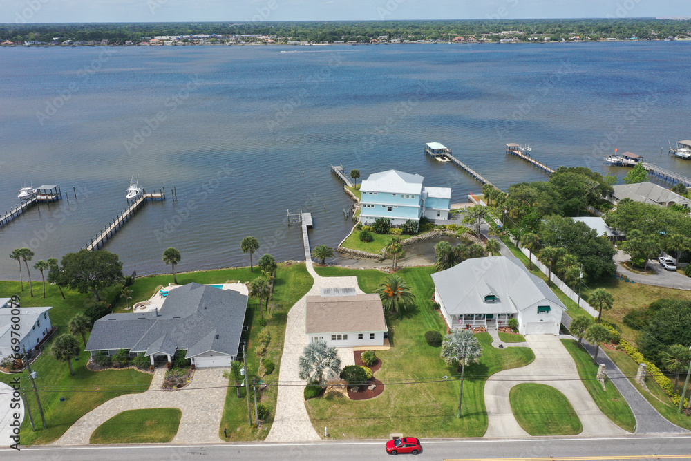 Aerial view of affluent Halifax River (Intracoastal Waterway) front ...