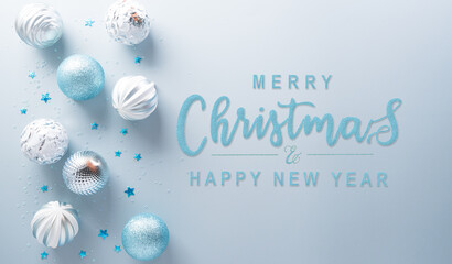 Wall Mural - Christmas and new year background decoration concept. Top view of Christmas ball,  star and snowflake on pastel blue background.