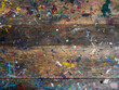 © tete_escape - Wood plank top table covered in oil or acrylic color paint splatter. Abstract texture of old rustic wooden desk background of artist workshop studio with messy colorful color painted splash, top view.