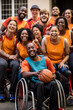 Group photo of a diverse basketball team, including both able-bodied and wheelchair players, all beaming with joy and looking towards the camera.