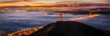San Francisco Golden Gate Bridge At Sunrise Covered In Fog / Clouds