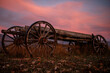 old farm wagon in Montana field blue pink sunset
