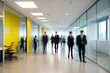 © Cavan - Bright business workplace with people walking in blurred motion