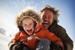 Dad and son happily sled down the hill