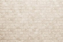 Empty Background Of Wide Cream Brick Wall Texture. Beige Old Brown Brick Wall Concrete Or Stone Textured, Wallpaper Limestone Abstract Flooring. Grid Uneven Interior Rock. Home Decor Design Backdrop.