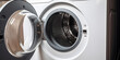 Detailed close-up of a washing machine's drum at a washing machine with a front-load door.