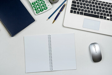 Poster - Top view of office workplace desk with laptop pen on notebook