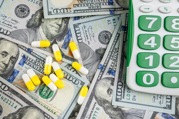 Wall Mural - calculator US dollars bills with medical pills tablets