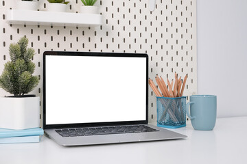 Poster - Laptop with blank white screen on office desk