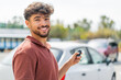 © luismolinero - Young Arabian handsome man at outdoors holding car keys with happy expression