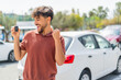 © luismolinero - Young Arabian handsome man holding car key at outdoors celebrating a victory