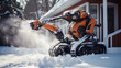 Robot snow plow removes snow after a heavy snowfall near the house, close-up, blizzard, snow in the lens