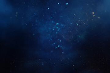 Wall Mural - abstract glitter black, silver , blue lights background. de-focused