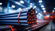 a stack of steel pipes in a warehouse or factory with a blurry background