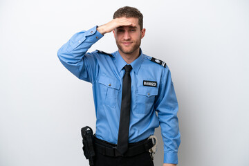 Wall Mural - Young police caucasian man isolated on white background looking far away with hand to look something