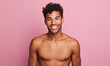 © Lidok_L - Shirtless black man with curly hair smiles confidently.