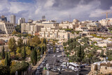 Fototapeta Paryż - The downtown of Jerusalem, Israel, with the street road, David Citadel Hotel and shopping mall during the cloudy autumn day.