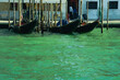 Gondolas moored in the Venice lagoon. In the distance the island of San Giorgio Maggiore.