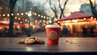 A cup of coffee with cookies on a wooden table near christmas lights.