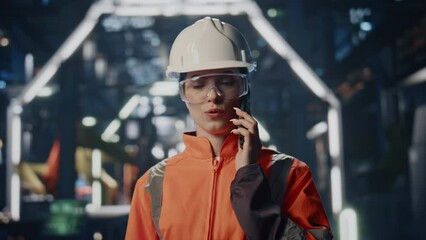 Poster - Serious industrial worker calling at factory closeup. Employee cellphone talk