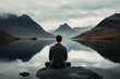 Man in yoga pose on a lake overlooking a nice landscape. New Year resolutions.