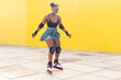 © ADDICTIVE STOCK - Happy Young Female Rollerskating At Skate Park