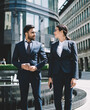 © BullRun - diverse business people in formal suit strolling in financial district