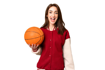 Canvas Print - Young basketball player woman over isolated chroma key background with surprise facial expression