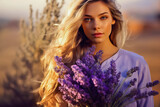 Fototapeta Lawenda - Portrait of a beautiful young woman with a bouquet of lavender in her hands.