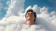 Happy man sleeping and dreaming on comfortable white clouds in the sky.