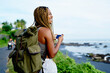  happy smiling woman with backpack enjoying new adventure during holiday time