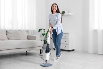 Poster - Happy woman cleaning floor with steam mop at home