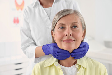 Sticker - Endocrinologist examining thyroid gland of patient at hospital, closeup