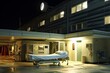 © sandra - emergeny room emergency hospital care health medicals medicine exterior building twilight night light signs dark modern architecture architectural clinic help entrance driveway car park road street