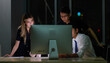 © Bangkok Click Studio - Asian professional skilled male programmer helping  computer problems for businesswoman employee working night shift overtime with male female businessman colleagues in office.