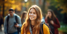 The Portrait Of A Smiling Female Student Freshman Carrying A Backpack Shot At The Entrance Of A College Or University On The First Day, Blurry Background. Generative AI.