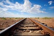 rusty train tracks leading to nowhere