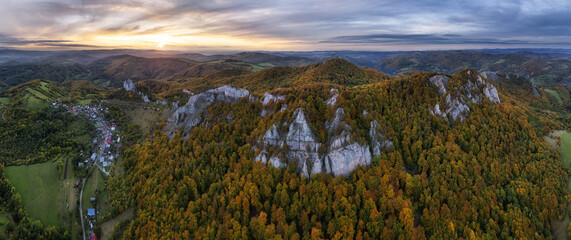 Wall Mural - Mountains at sunset in Slovakia - Vrsatec. Landscape with mountain hills orange trees and grass in fall, colorful sky from drone, Aerial Panorama