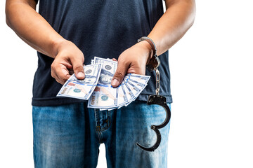 Arrested man with a handcuff on his hand holding money