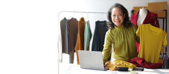 senior female designer works as a fashion designer and owns a small business, a successful online cl